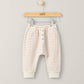 Cream striped joggers with pink lines, button front and elastic waistband cuffs