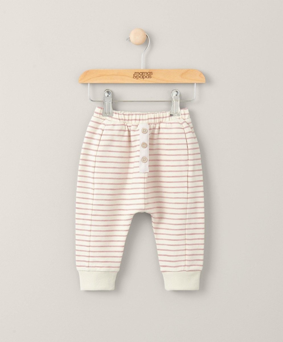 Cream striped joggers with pink lines, button front and elastic waistband cuffs