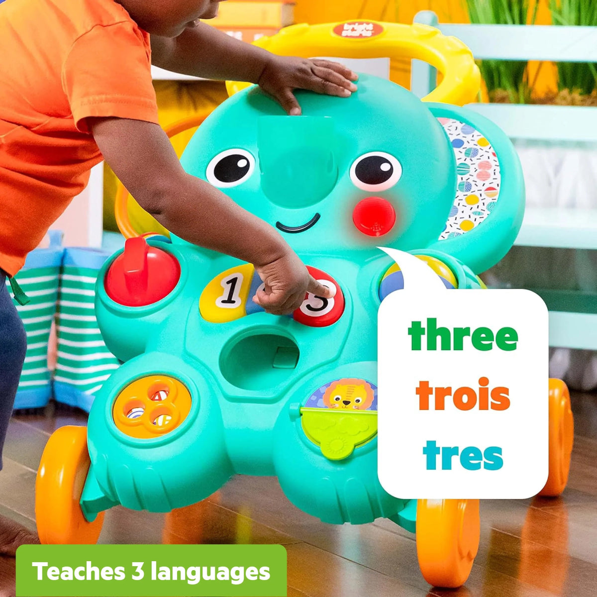 Child pushing turquoise elephant walker with number controls, red push button