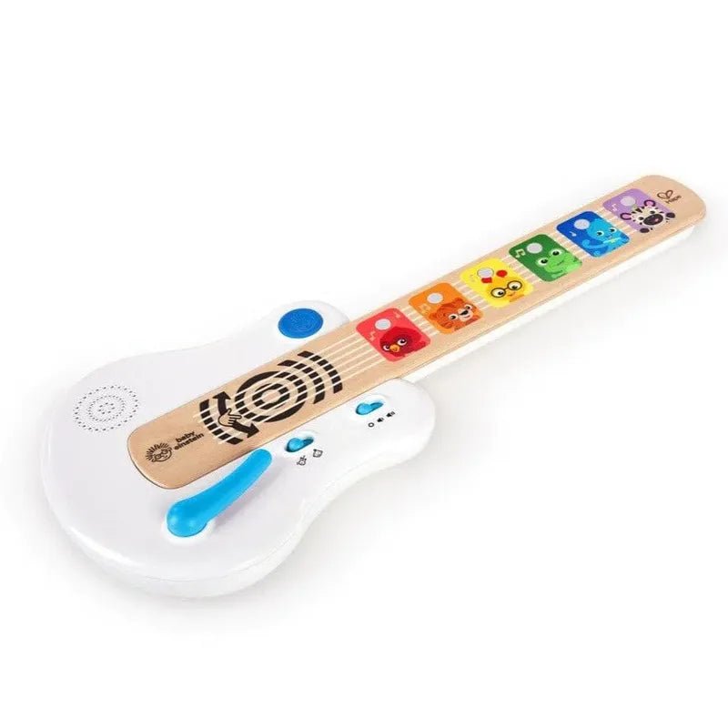 Toy guitar with tan handle, animal sticker keypad, white body and blue slide switch