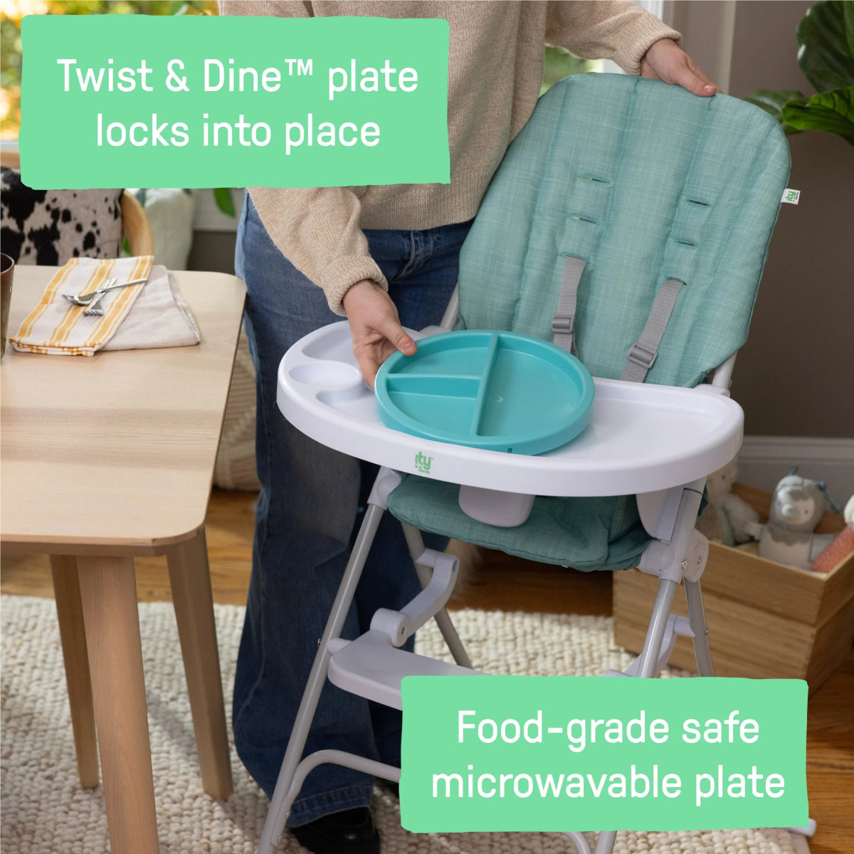 Teal high chair tray holding turquoise plate insert, side view.
