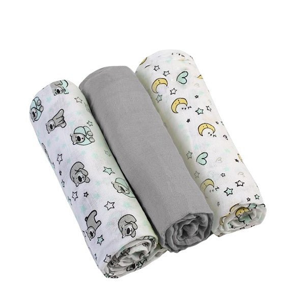 Set of muslin baby diapers, animal prints with a solid gray roll in the middle
