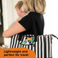 Musical toy inside a black-and-white striped tote bag with colorful character piece