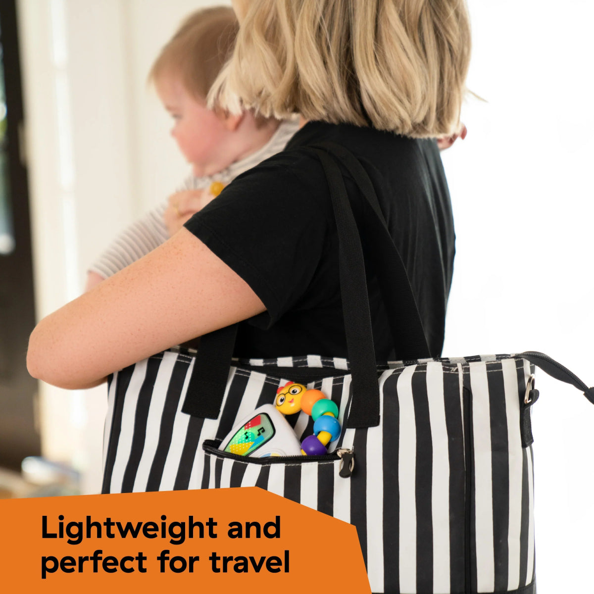 Musical toy inside a black-and-white striped tote bag with colorful character piece