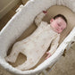Cream teddy-print all-in-one romper, front zip, worn while lying down