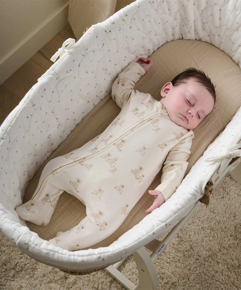 Cream teddy-print all-in-one romper, front zip, worn while lying down