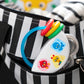 Baby musical tambourine rattle with circular frame, animal faces, multicolor rings