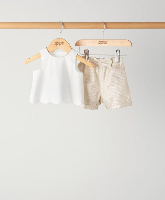 2-piece jacquard short set: white sleeveless top and textured shorts, on hangers