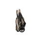 TRVL compact stroller in hazelwood folded side view with wheels and carrying strap