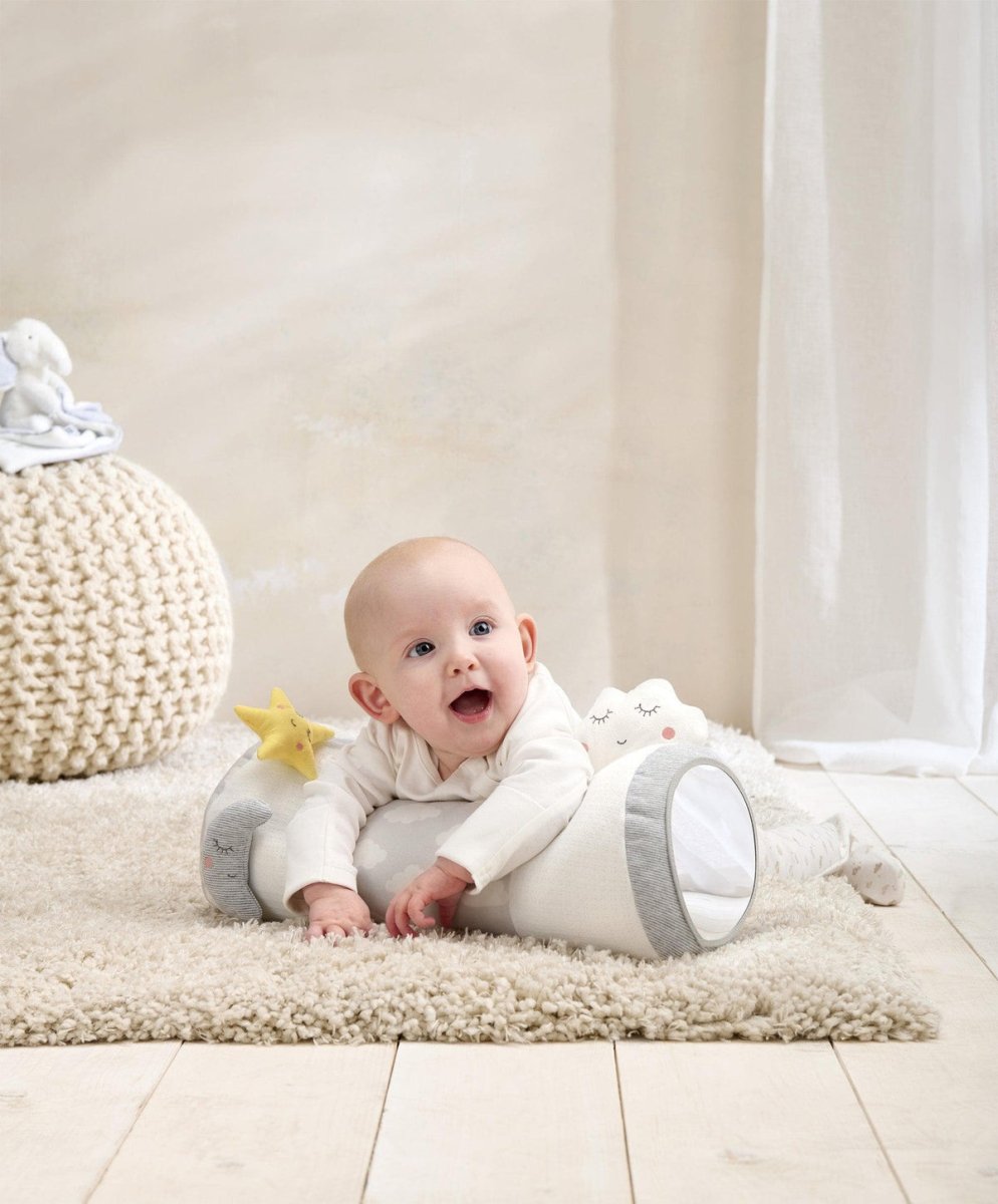 Tummy time roll with cloud print, yellow star, plush cloud end; baby leaning on it