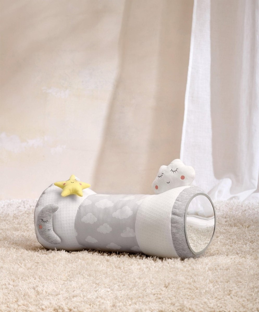 Cloud-print tummy time roll with yellow star toy, gray cylinder with white plush ends