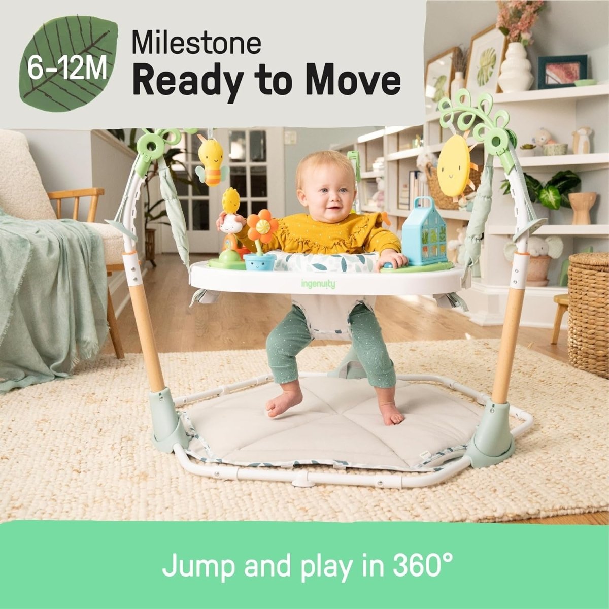 Infant play center with hanging toys and round padded base, baby standing