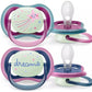 Two baby pacifiers with light bulb teats, purple/pink frames, 'dreams' panel
