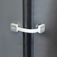 White furniture lock strap latch securing cabinet door edge
