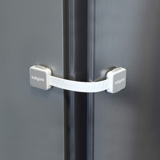 White furniture lock strap latch securing cabinet door edge