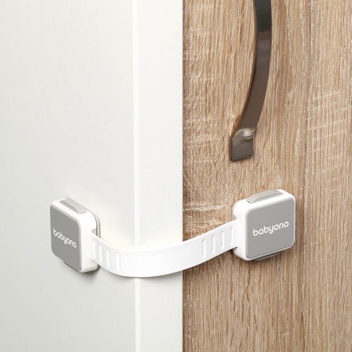 Cabinet lock set with white latches, adhesive pads, and flexible strap
