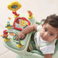 Baby play tray with animal artwork, side toys, and a child leaning in