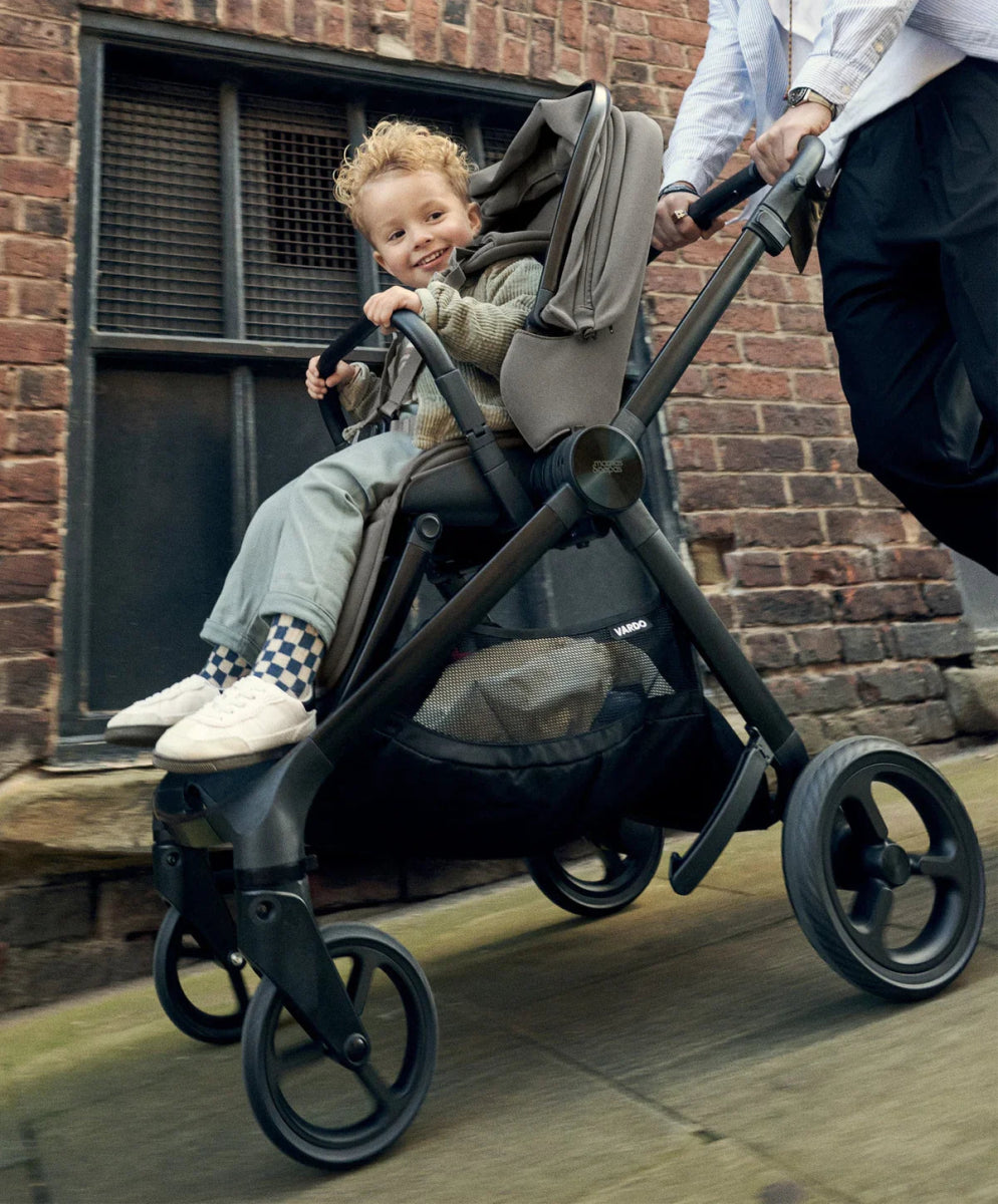 Vardo pushchair with sage seat and canopy, toddler seated facing forward