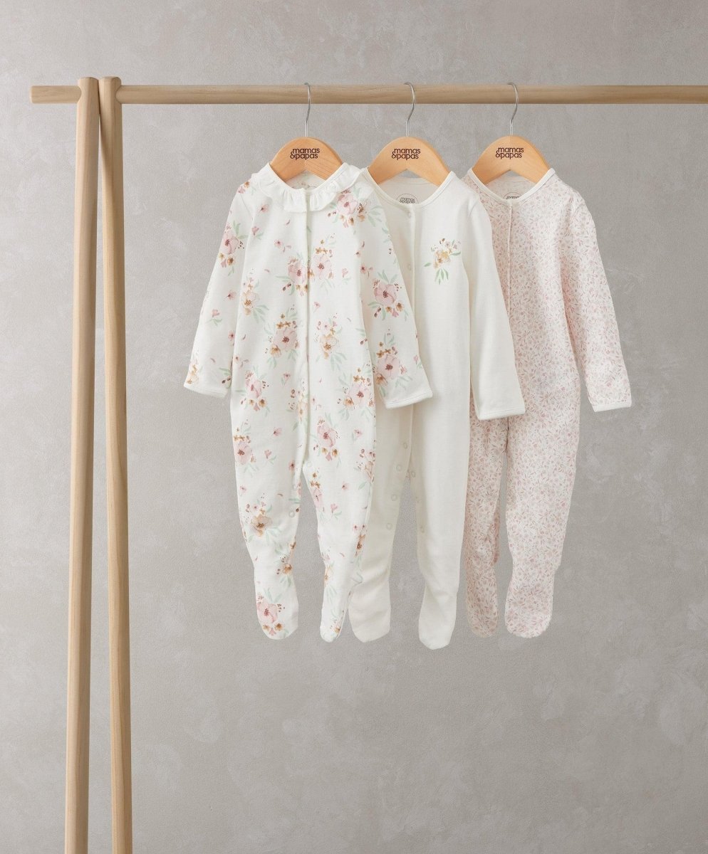 Baby sleepsuit set of 3: floral white, solid white, pale pink speckled all-in-ones