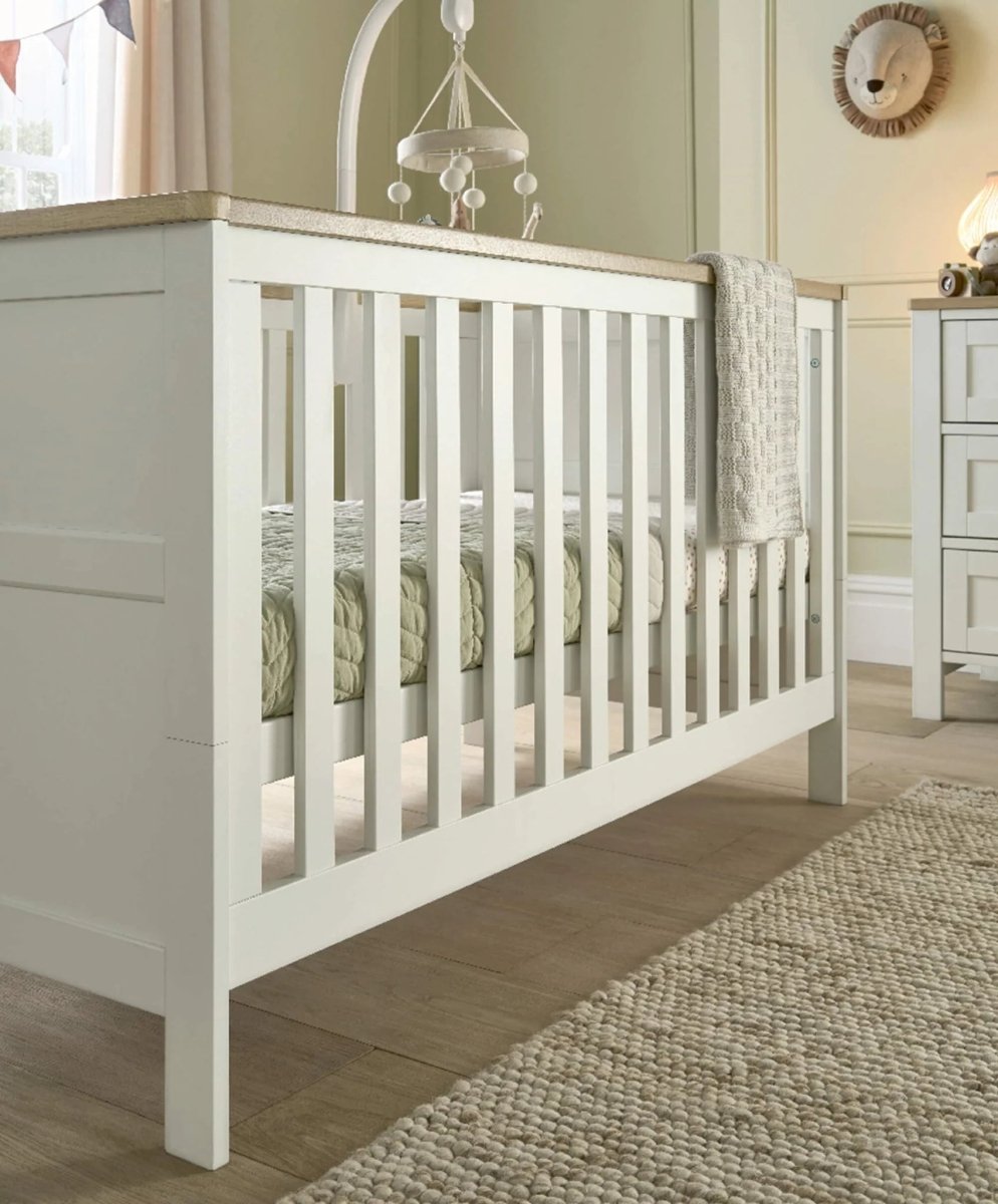 White cotbed with slatted sides and end panels