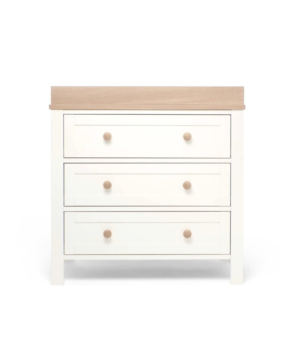 White nursery dresser changer with natural top and three drawer fronts, round wood knobs