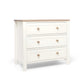 White nursery dresser changer with natural top and three drawers, two round wood knobs per drawer