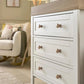 White nursery dresser changer with natural top and four drawers, round knobs