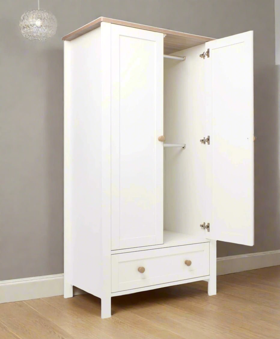 Nursery wardrobe with open double doors, interior storage, white cabinet with brass hinges
