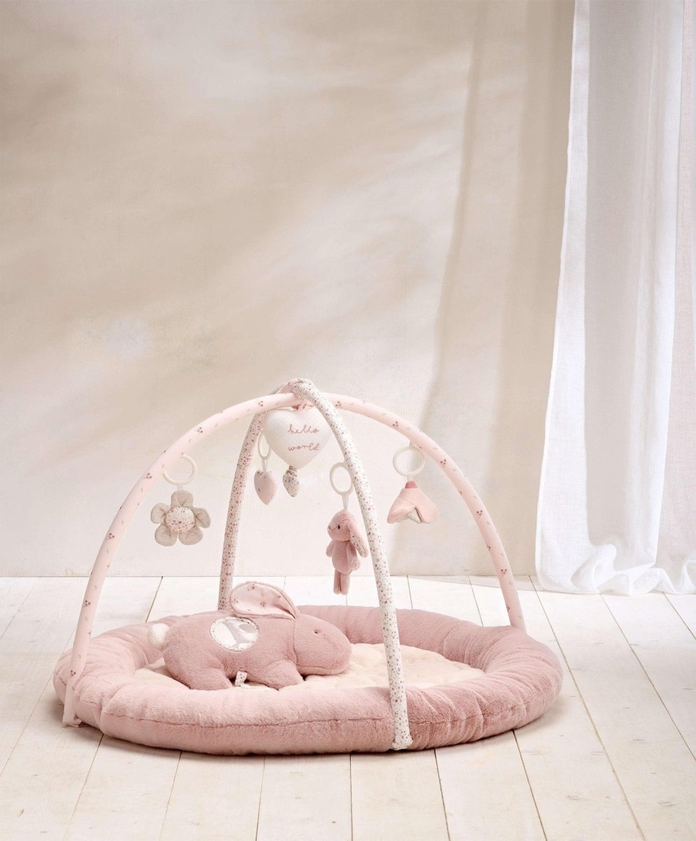 Pink bunny playmat with arch and soft pink padded floor, hanging plush toys