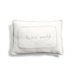 White cushion with quilted border and centered cursive 'world' print