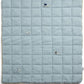 Light blue cotbed quilt, quilted grid with small sheep embroidery on fabric