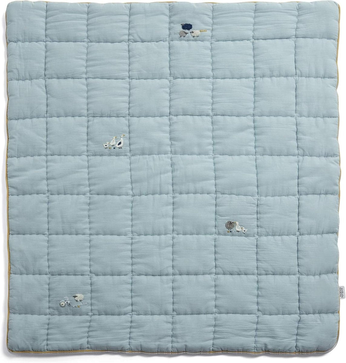 Light blue cotbed quilt, quilted grid with small sheep embroidery on fabric