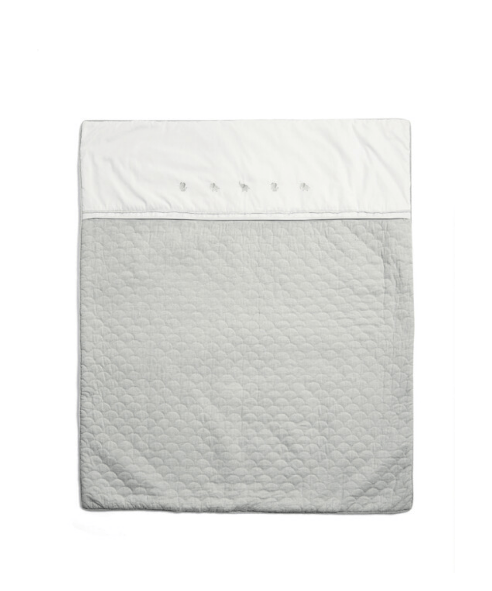 Cotbed quilt, white with light gray quilted pattern and stitched border