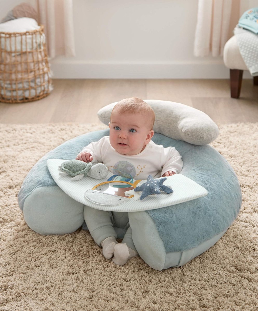 Blue plush activity seat with undersea play mat, baby seated in center