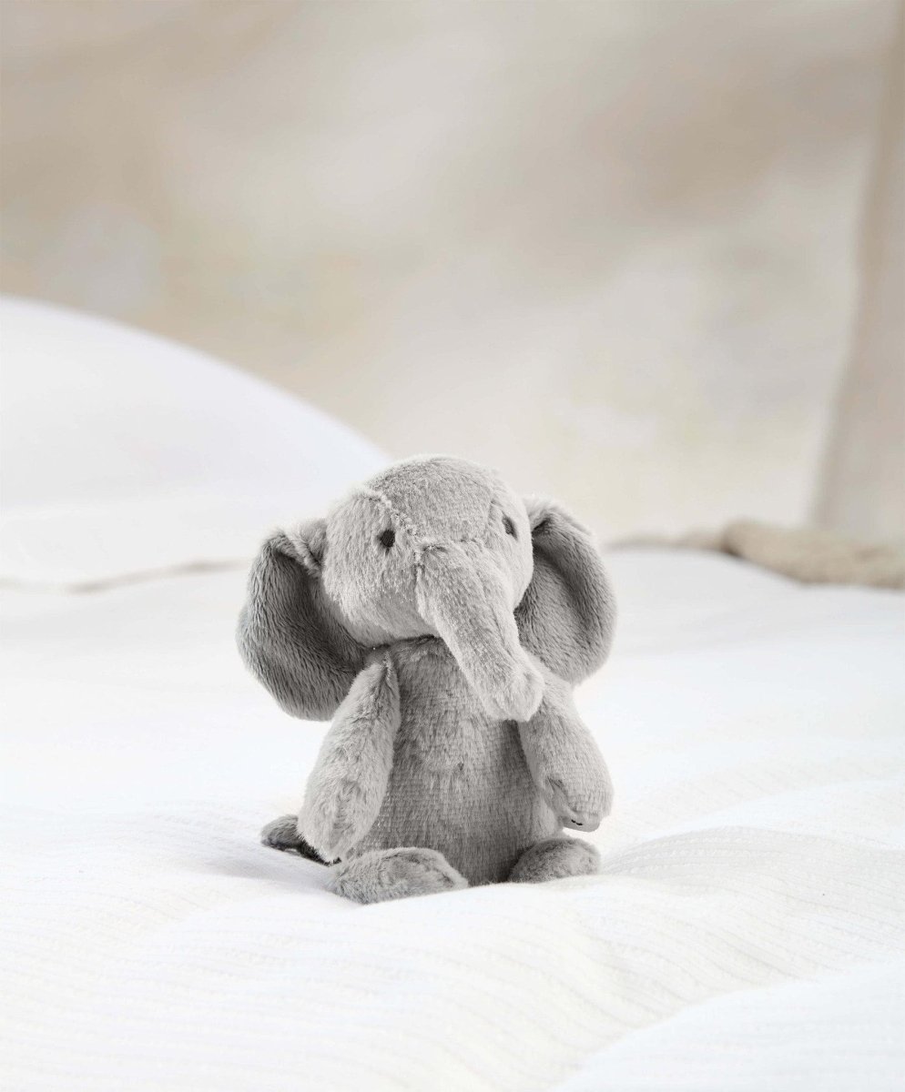 Small plush elephant toy, light gray with long trunk and floppy ears