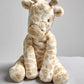 Stuffed giraffe plush toy with long neck and spotted pattern, beige and cream.