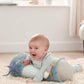 Blue ocean-themed tummy time roll with plush sea animals, used during baby tummy time