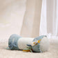 Blue ocean-themed tummy time roll with plush fish and sea creatures, curved bolsters