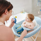 Baby bath tub on stand, light blue oval basin with whale-themed shape detail