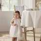 White organza bow dress, front view with ruffle yoke and bow at neckline