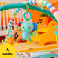 Plush elephant dangling from striped arch on green baby play mat