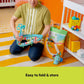 Folded green activity play mat held for storage and transport