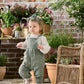 Green woven dungarees with bow headband, sleeveless overalls on child
