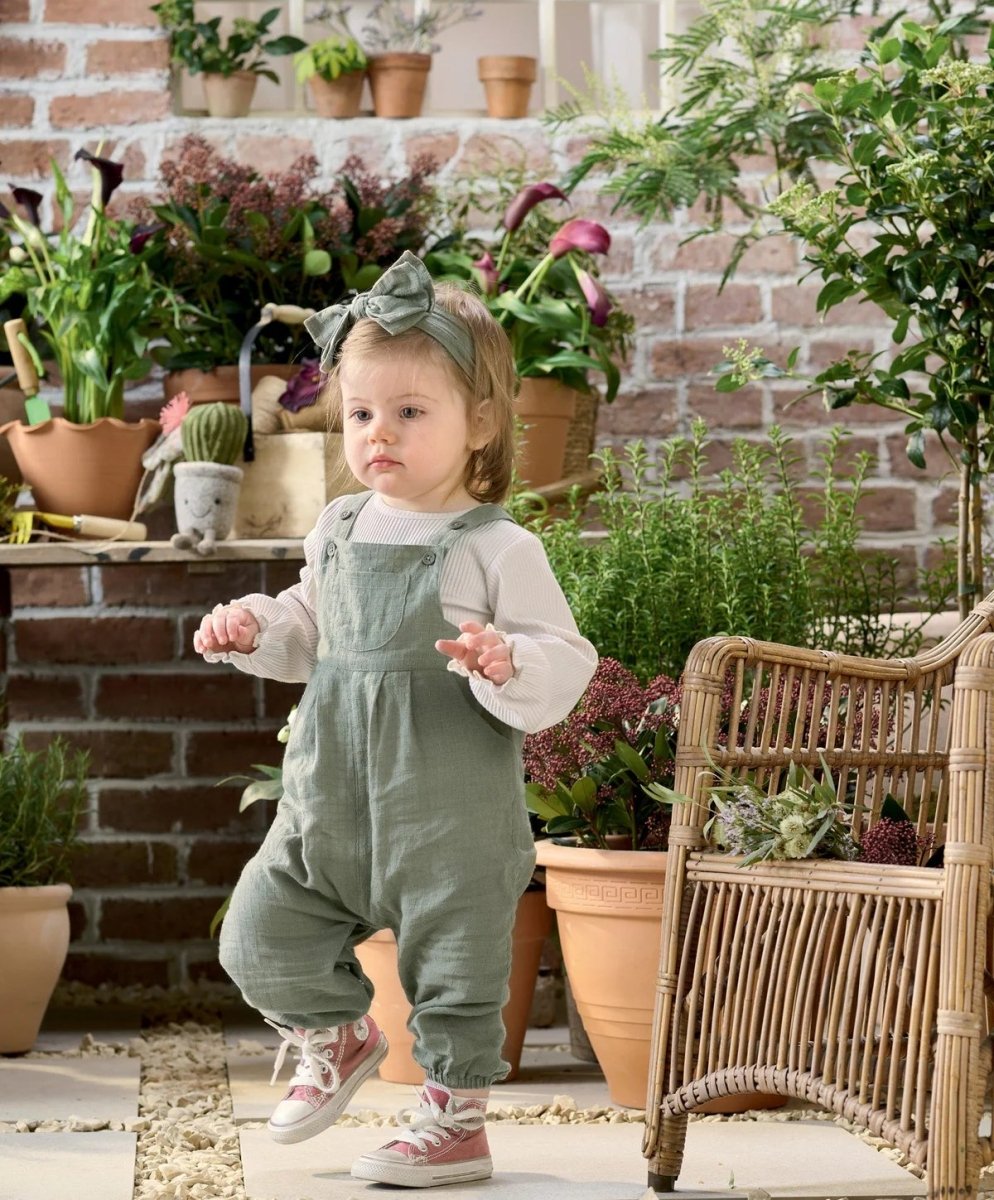 Green woven dungarees with bow headband, sleeveless overalls on child