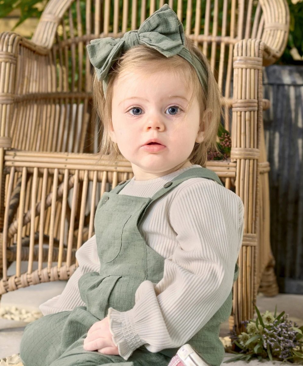 Green dungarees with bow headband, sleeveless overalls with pocket detail