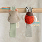 Hanging plush wrist rattles: gray hippo and red ladybird with striped body