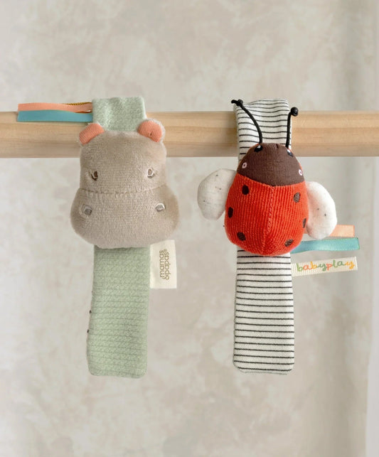 Hanging plush wrist rattles: gray hippo and red ladybird with striped body