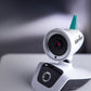 Close-up of white video baby monitor camera with teal antenna and lens