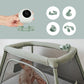 Portable baby monitor camera and green mounting accessories in hand