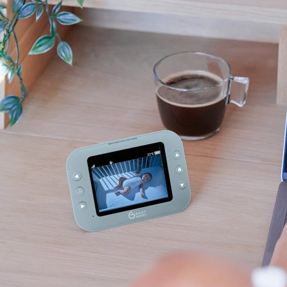 Light blue roll video monitor with touchscreen displaying a sleeping baby on screen